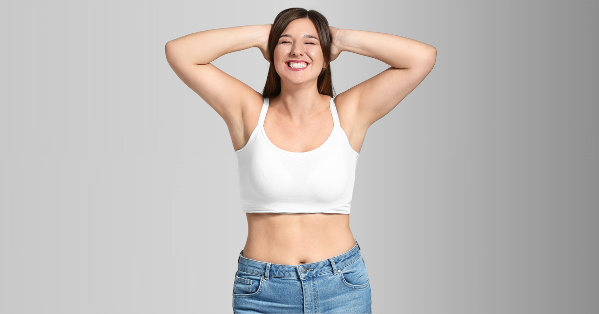 smiling, lovely woman displaying her gorgeous physique