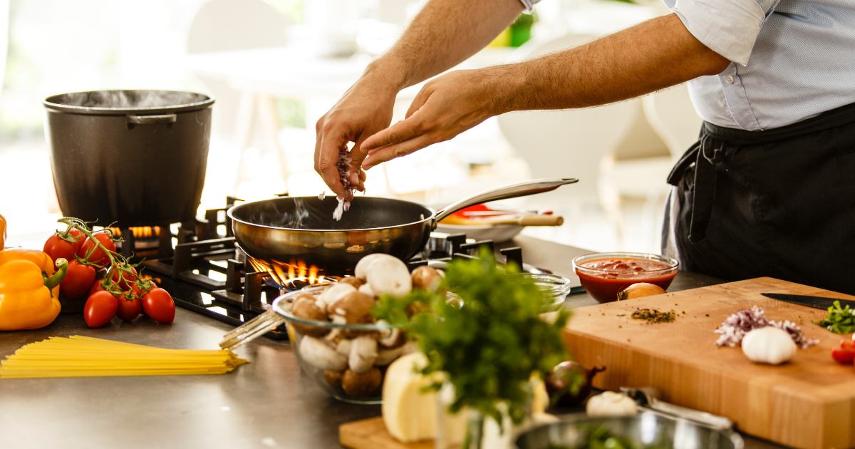 someone cooking in a kitchen