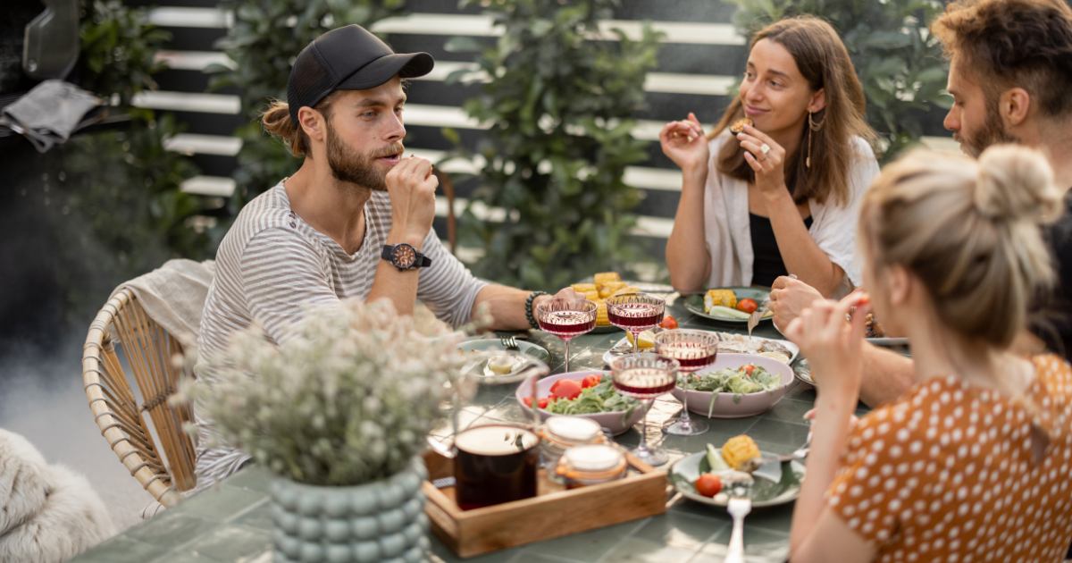 someone eating healthy foods with friends